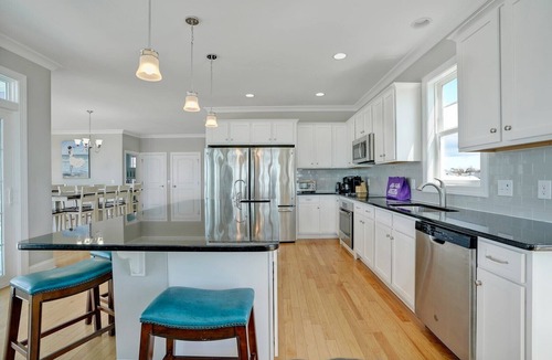 Long Beach House | Discover oceanfront bliss at 7th Heaven in Oak Island, NC—spacious 7BR, sleeps 24!