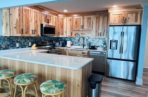 Holden Beach House | Experience oceanfront luxury at Serenity's Star, a spacious 4BR home in Holden Beach.