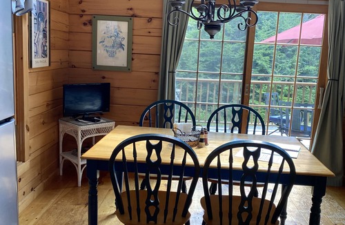 Kents Hill House | Light-Filled Log Home, 4 Wooded Acres, & Lake Access. The water is 0.4 mi away.