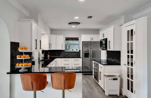 Deerfield Beach House | Luxury 5-bedrooms 4-bathrooms waterfront home heated pool, Tiki, Outdoor Kitchen