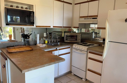 Punaluu Condo | Secluded , cozy poolside getaway. Ocean views, near black sand beach & turtles.