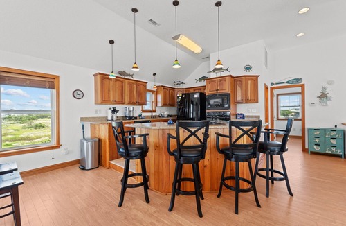 Frisco House | Waterfront home with boat dock, shared pool, & balcony with ocean view