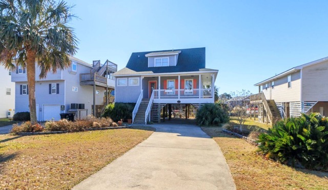 Canalfront home w/wraparound decks and community amenities!