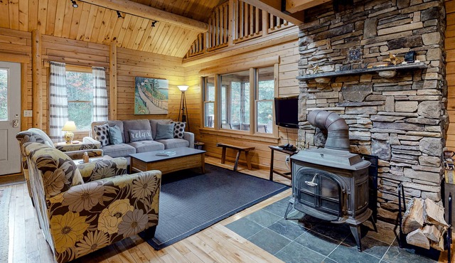Charming, Lakefront Cabin with a Fireplace, Wood Stove, Kayaks, & Sandy Beach