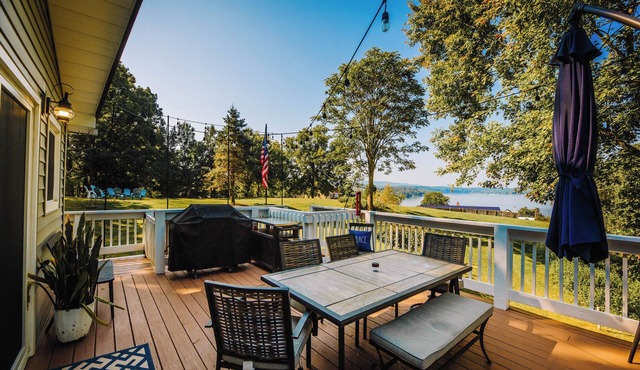 Charming lakeside retreat with serene views, cozy interiors, spacious deck, and lush outdoor spaces.