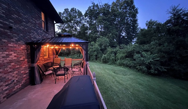 Close to everything, with 1,000 sqft entertainment area, grill and gazebo. in Bristol