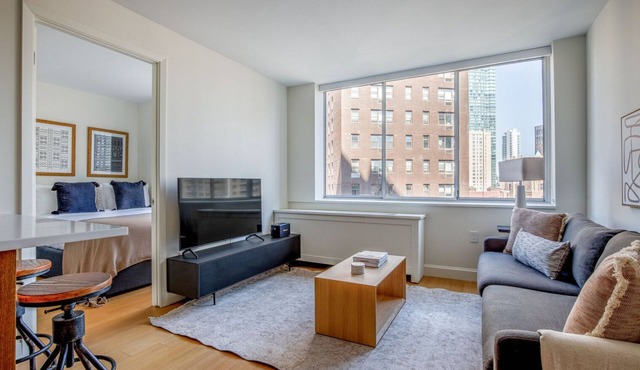 Ideal Midtown East 2BR w/Gym & Roofdeck, nr Parks, by Blueground