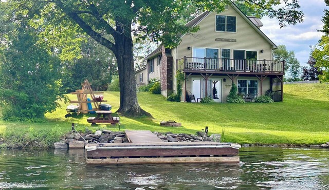 Lakeside house on Webber Pond with a small beach and stunning, peaceful views.