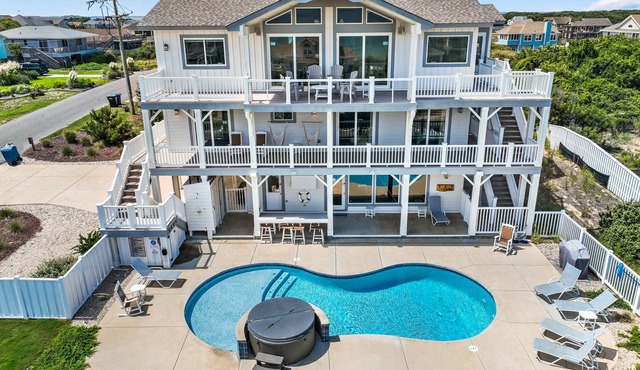 Luxurious home steps from beach with pool, hot tub, game room & fireplace