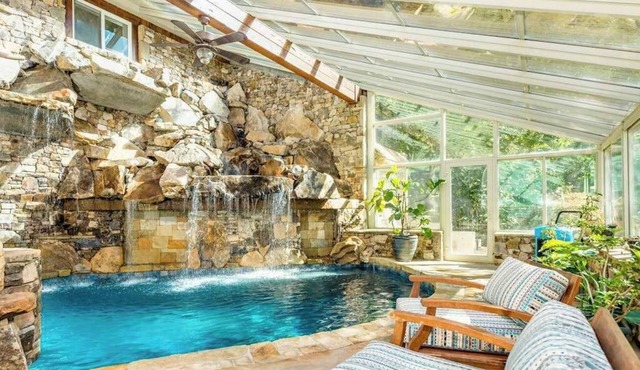 Riverside opulence with game room, private heated pool, hot tub & firepit